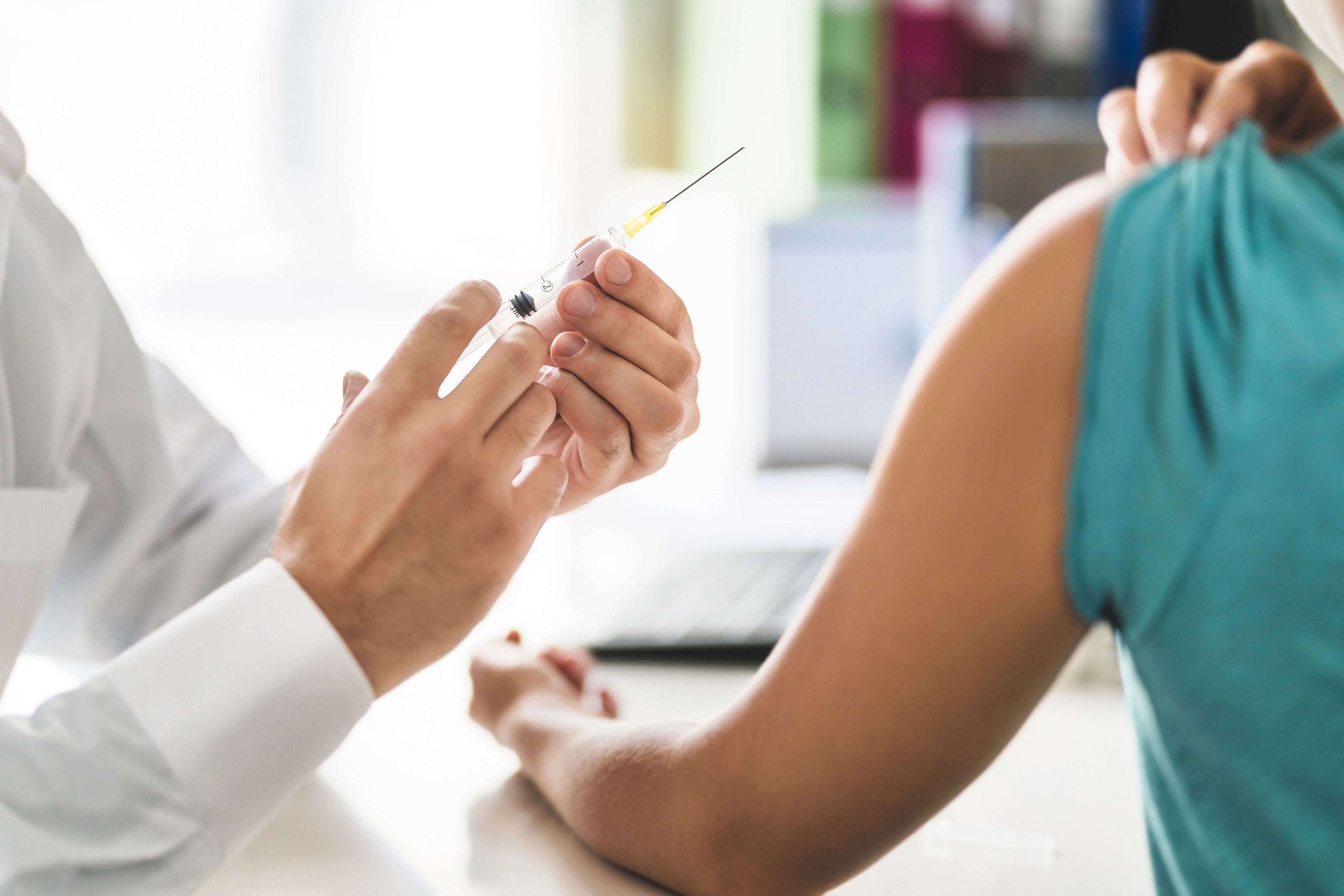 flu vaccine being given to patient