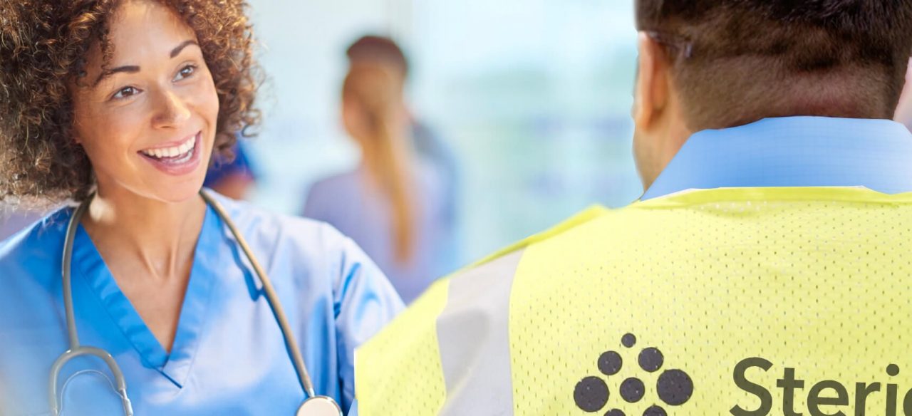 healthcare nurse talking to stericycle staff member